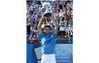 EASTBOURNE, ENGLAND - JUNE 21:  Feliciano Lopez of Spain celebrates with the trophy after beating Richard Gasquet of France during their Men's Singles Finals match on day eight of the Aegon International at Devonshire Park on June 21, 2014 in Eastbourne, England. (Photo by Jan Kruger/Getty Images)